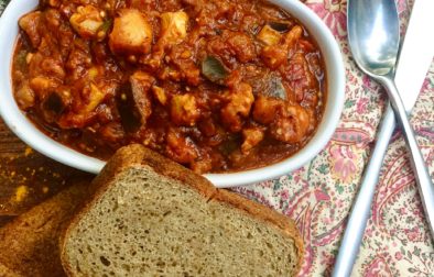 Harissa Chicken & Eggplant Stew served with a slab of homemade Bread